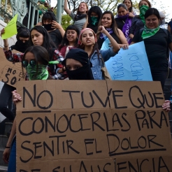 Feminist protestors enter the Bellas Artes metro station in downtown Mexico City Feb. 21, 2020.
